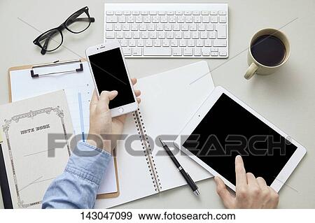 Top-down view of businesman working in the office View Large Photo Image Stock Photo - Top-down view of businesman working in the office. Fotosearch