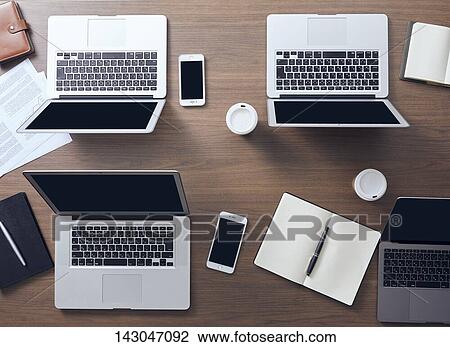 Stock Image - Top-down view of office equipment. Fotosearch