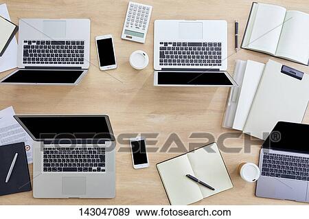 Top-down view of office equipment View Large Photo Image Stock Photo - Top-down view of office equipment. Fotosearch