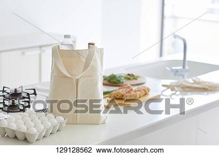 Stock Image - Tote Bag On The Kitchen Table. Fotosearch