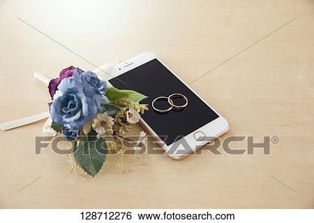 Wedding Rings On The Smartphone View Large Photo Image Stock Photograph - Wedding Rings On The Smartphone. Fotosearch