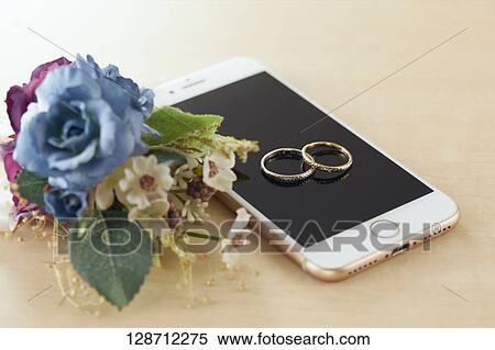 Wedding Rings On The Smartphone View Large Photo Image Stock Photography - Wedding Rings On The Smartphone. Fotosearch