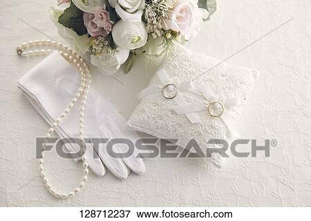 Wedding Rings With A Bouquet And Globes View Large Photo Image Stock Photo - Wedding Rings With A Bouquet And Globes. Fotosearch