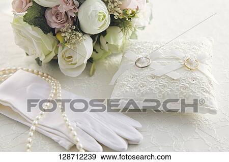 Wedding Rings With A Bouquet And Globes View Large Photo Image Stock Photo - Wedding Rings With A Bouquet And Globes. Fotosearch
