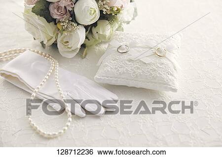 Wedding Rings With A Bouquet And Globes View Large Photo Image Stock Photograph - Wedding Rings With A Bouquet And Globes. Fotosearch