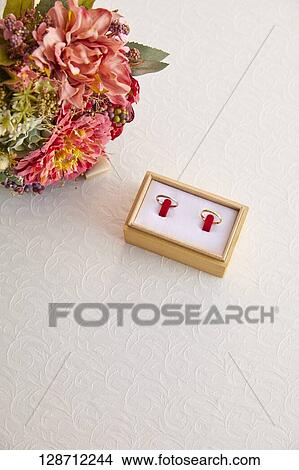 Wedding Rings With A Bouquet View Large Photo Image Picture - Wedding Rings With A Bouquet. Fotosearch
