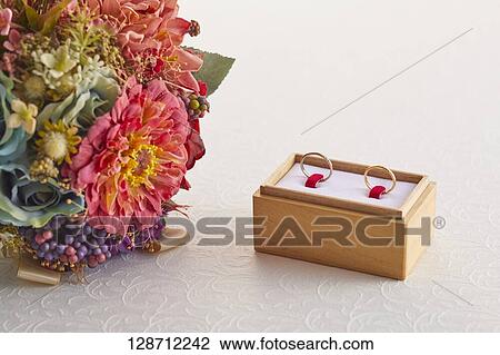 Wedding Rings With A Bouquet View Large Photo Image Stock Image - Wedding Rings With A Bouquet. Fotosearch