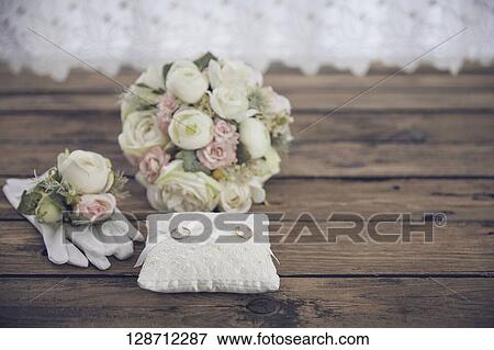 Stock Photo - Wedding Rings With Flowers. Fotosearch