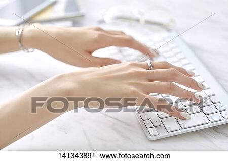 Stock Image - Woman Working With Keyboard. Fotosearch