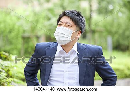 Young Japanese businessman wearing mask in the hot Summer downtown Tokyo View Large Photo Image Stock Image - Young Japanese businessman wearing mask in the hot Summer downtown Tokyo. Fotosearch