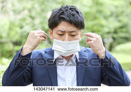 Young Japanese businessman wearing mask in the hot Summer downtown Tokyo View Large Photo Image Stock Image - Young Japanese businessman wearing mask in the hot Summer downtown Tokyo. Fotosearch