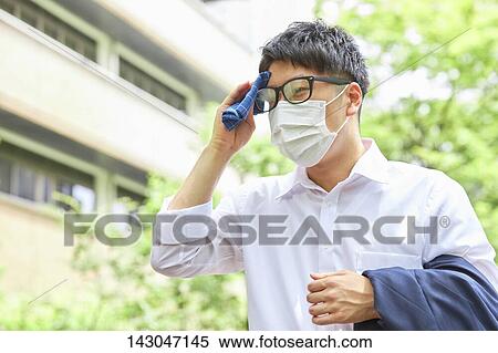 Young Japanese businessman wearing mask in the hot Summer downtown Tokyo View Large Photo Image Stock Photography - Young Japanese businessman wearing mask in the hot Summer downtown Tokyo. Fotosearch