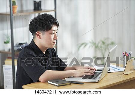 Young Japanese businessman working with laptop View Large Photo Image Stock Image - Young Japanese businessman working with laptop. Fotosearch