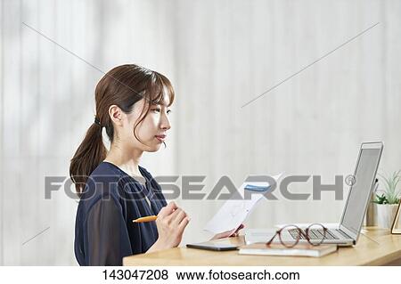 Young Japanese businesswoman having remote meeting at home View Large Photo Image Stock Photo - Young Japanese businesswoman having remote meeting at home. Fotosearch