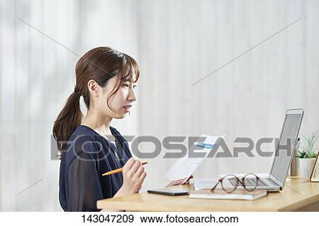 Young Japanese businesswoman having remote meeting at home View Large Photo Image Stock Photo - Young Japanese businesswoman having remote meeting at home. Fotosearch