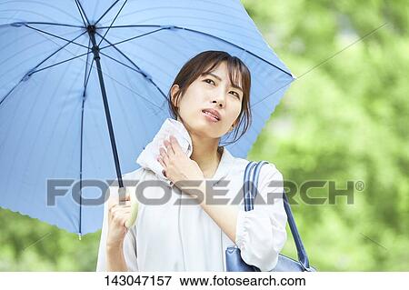 Young Japanese businesswoman in the hot Summer downtown Tokyo View Large Photo Image Stock Photo - Young Japanese businesswoman in the hot Summer downtown Tokyo. Fotosearch