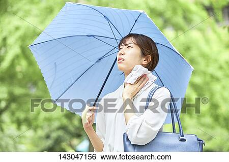 Young Japanese businesswoman in the hot Summer downtown Tokyo View Large Photo Image Stock Photograph - Young Japanese businesswoman in the hot Summer downtown Tokyo. Fotosearch