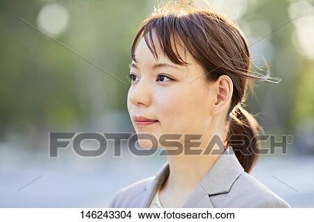 Young Japanese businesswoman outside View Large Photo Image Picture - Young Japanese businesswoman outside. Fotosearch