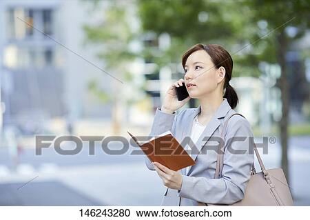 Young Japanese businesswoman outside View Large Photo Image Stock Image - Young Japanese businesswoman outside. Fotosearch