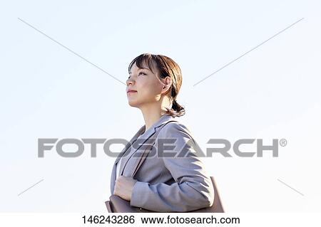 Young Japanese businesswoman outside View Large Photo Image Stock Photograph - Young Japanese businesswoman outside. Fotosearch