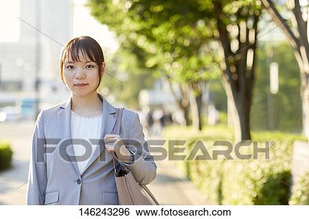 Young Japanese businesswoman outside View Large Photo Image Stock Photograph - Young Japanese businesswoman outside. Fotosearch
