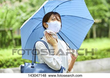 Young Japanese businesswoman wearing mask in the hot Summer downtown Tokyo View Large Photo Image Stock Photo - Young Japanese businesswoman wearing mask in the hot Summer downtown Tokyo. Fotosearch