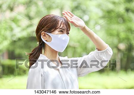 Young Japanese businesswoman wearing mask in the hot Summer downtown Tokyo View Large Photo Image Stock Photograph - Young Japanese businesswoman wearing mask in the hot Summer downtown Tokyo. Fotosearch