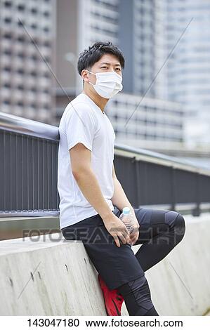 Young Japanese man training downtown Tokyo View Large Photo Image Stock Image - Young Japanese man training downtown Tokyo. Fotosearch