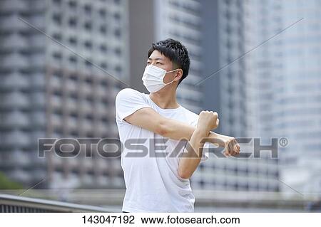 Young Japanese man training downtown Tokyo View Large Photo Image Stock Image - Young Japanese man training downtown Tokyo. Fotosearch