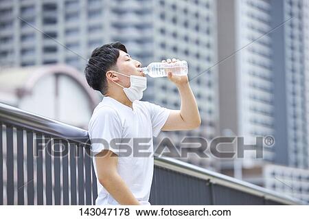 Young Japanese man training downtown Tokyo View Large Photo Image Stock Photo - Young Japanese man training downtown Tokyo. Fotosearch