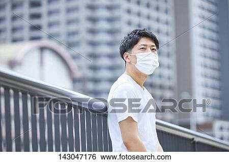 Young Japanese man training downtown Tokyo View Large Photo Image Stock Photograph - Young Japanese man training downtown Tokyo. Fotosearch