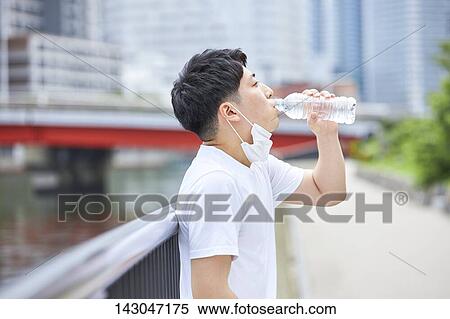 Young Japanese man training downtown Tokyo View Large Photo Image Stock Photography - Young Japanese man training downtown Tokyo. Fotosearch