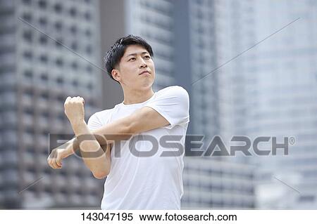 Young Japanese man training downtown Tokyo View Large Photo Image Stock Photography - Young Japanese man training downtown Tokyo. Fotosearch