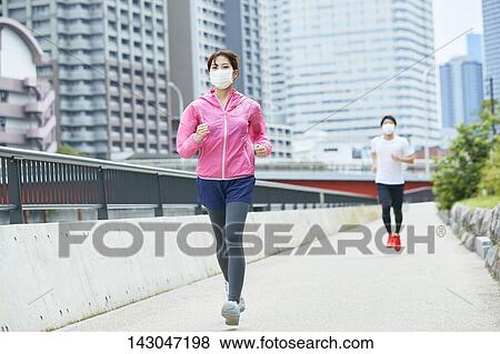Stock Photo - Young Japanese people training downtown Tokyo. Fotosearch