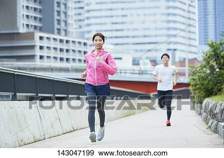 Stock Photo - Young Japanese people training downtown Tokyo. Fotosearch