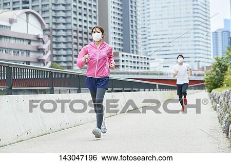 Stock Photograph - Young Japanese people training downtown Tokyo. Fotosearch