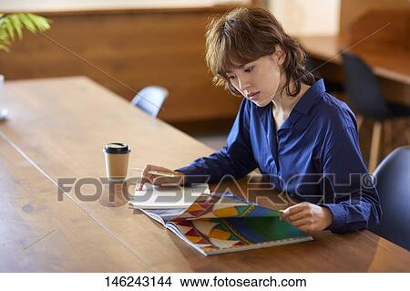 Young Japanese woman at a cafe View Large Photo Image Picture - Young Japanese woman at a cafe. Fotosearch
