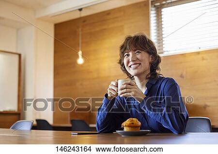 Young Japanese woman at a cafe View Large Photo Image Picture - Young Japanese woman at a cafe. Fotosearch
