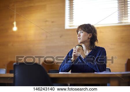 Young Japanese woman at a cafe View Large Photo Image Stock Image - Young Japanese woman at a cafe. Fotosearch