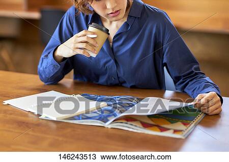 Young Japanese woman at a cafe View Large Photo Image Stock Image - Young Japanese woman at a cafe. Fotosearch