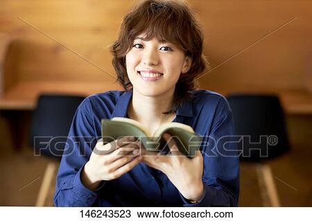Young Japanese woman at a cafe View Large Photo Image Stock Image - Young Japanese woman at a cafe. Fotosearch