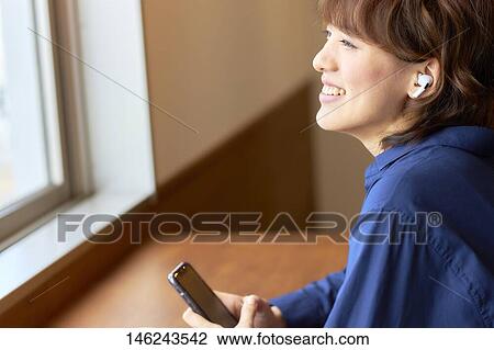Young Japanese woman at a cafe View Large Photo Image Stock Image - Young Japanese woman at a cafe. Fotosearch