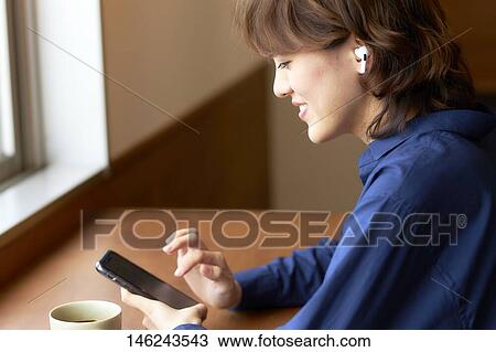 Young Japanese woman at a cafe View Large Photo Image Stock Image - Young Japanese woman at a cafe. Fotosearch