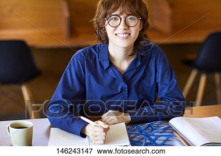 Young Japanese woman at a cafe View Large Photo Image Stock Photo - Young Japanese woman at a cafe. Fotosearch
