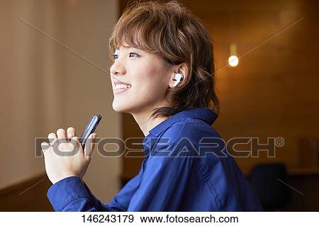 Young Japanese woman at a cafe View Large Photo Image Stock Photo - Young Japanese woman at a cafe. Fotosearch
