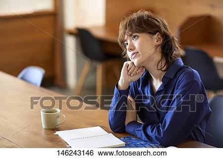 Young Japanese woman at a cafe View Large Photo Image Stock Photograph - Young Japanese woman at a cafe. Fotosearch