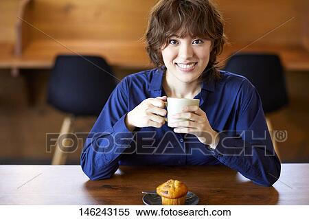 Young Japanese woman at a cafe View Large Photo Image Stock Photography - Young Japanese woman at a cafe. Fotosearch