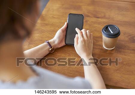 Young Japanese woman at a cafe View Large Photo Image Stock Photography - Young Japanese woman at a cafe. Fotosearch