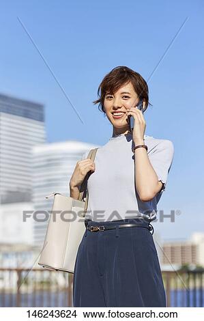 Young Japanese woman outside View Large Photo Image Picture - Young Japanese woman outside. Fotosearch