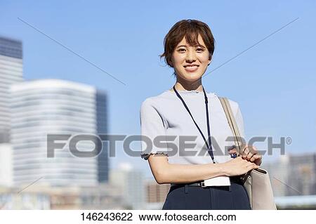 Young Japanese woman outside View Large Photo Image Stock Image - Young Japanese woman outside. Fotosearch